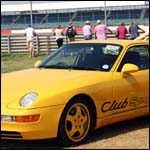 Yellow Porsche 968 ClubSport at the Silverstone Classic 2013