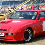 Red Porsche 924 Turbo OUF710W at the Silverstone Classic 2013