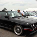 Black BMW E30 M3 at the Silverstone Classic 2013