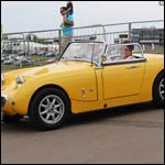 Yellow Austin Healey Frogeye Sprite at the Silverstone Classic 2