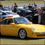 Yellow Porsche 911 RSR526 at the Silverstone Classic 2013